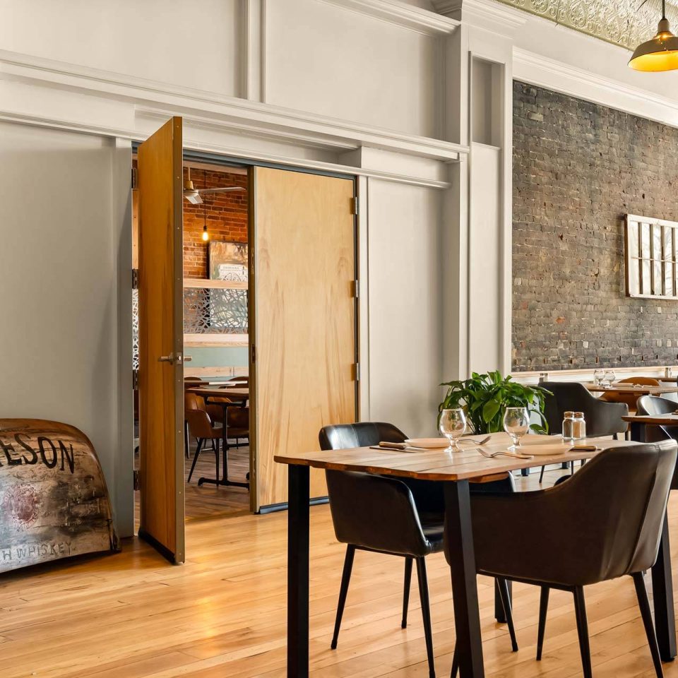 The Vic private dining room with brick and whiskey barrel
