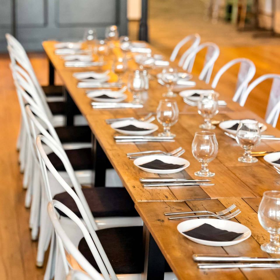 The Vic table set with black napkins and stemware