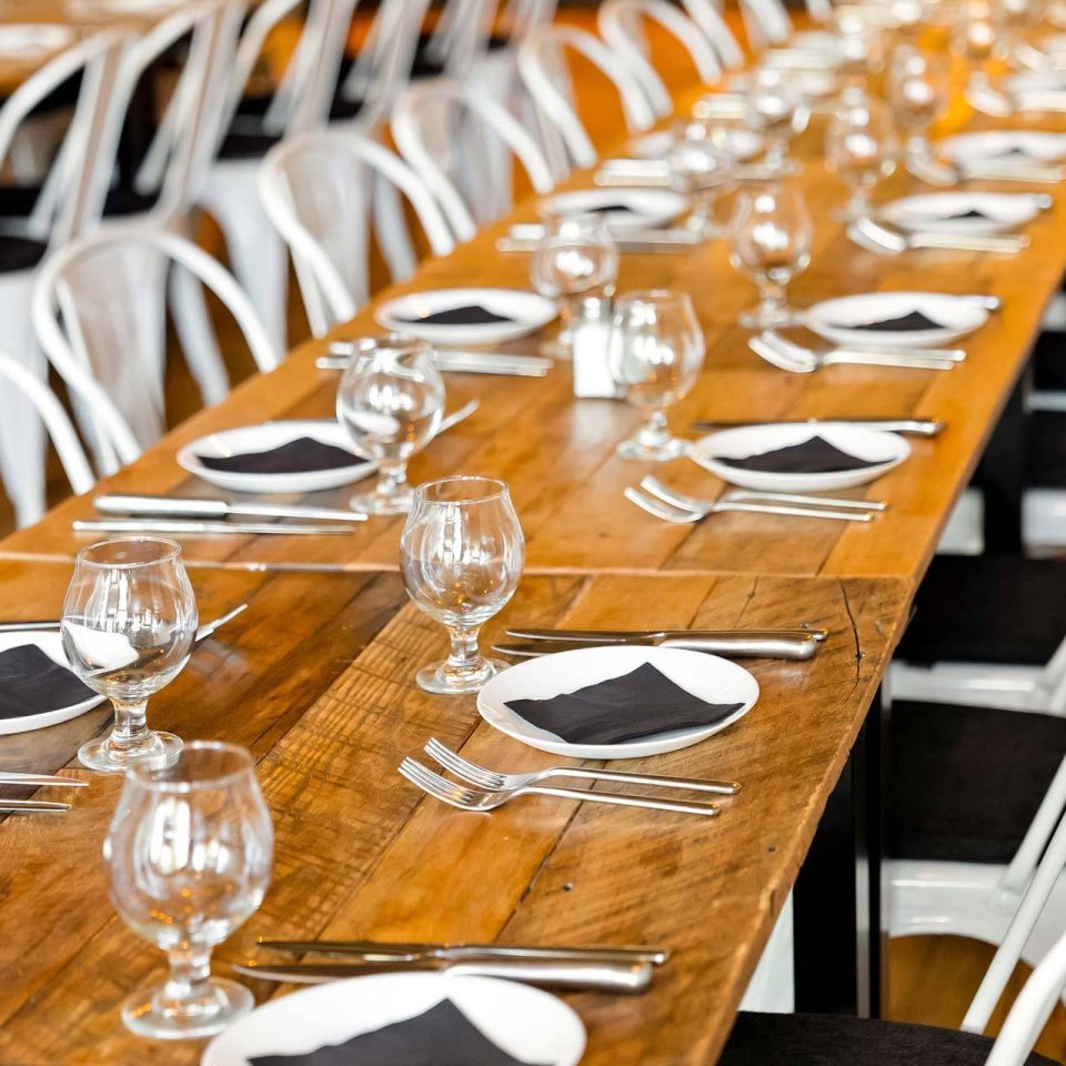 Place settings along a reclaimed wood table at The Vic