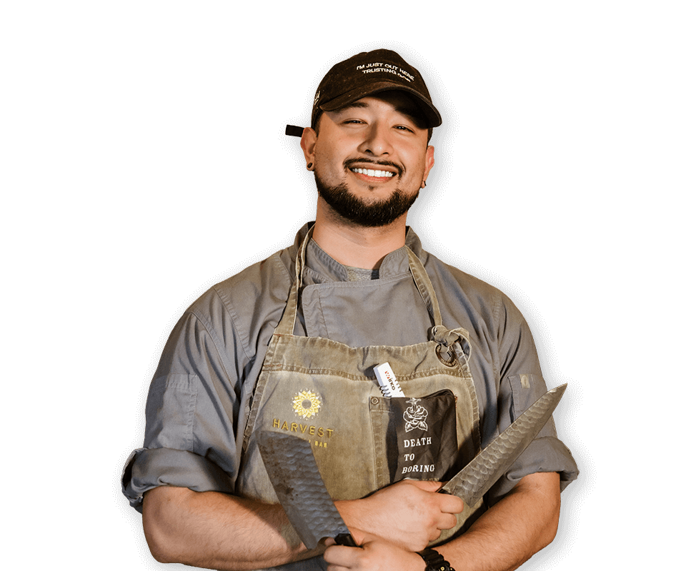 Chef portrait with Harvest Bar apron and knives