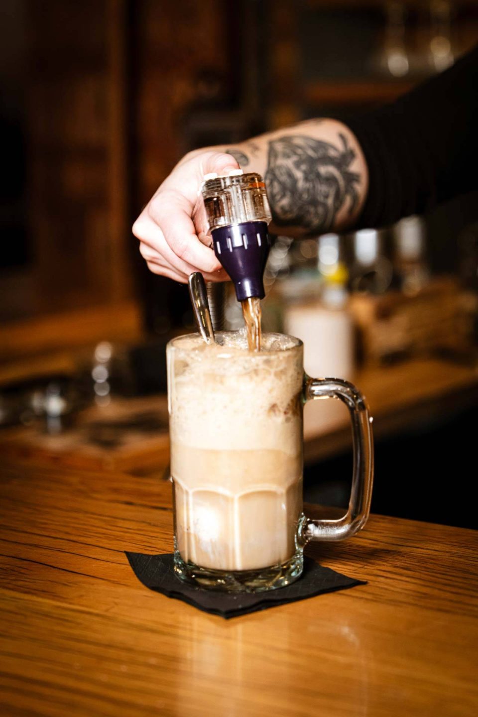 Bartender pouring a boozy root beer float